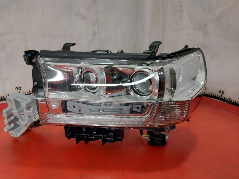 Фара ксеноновая левая Toyota Land Cruiser 200 8117060J80 новая